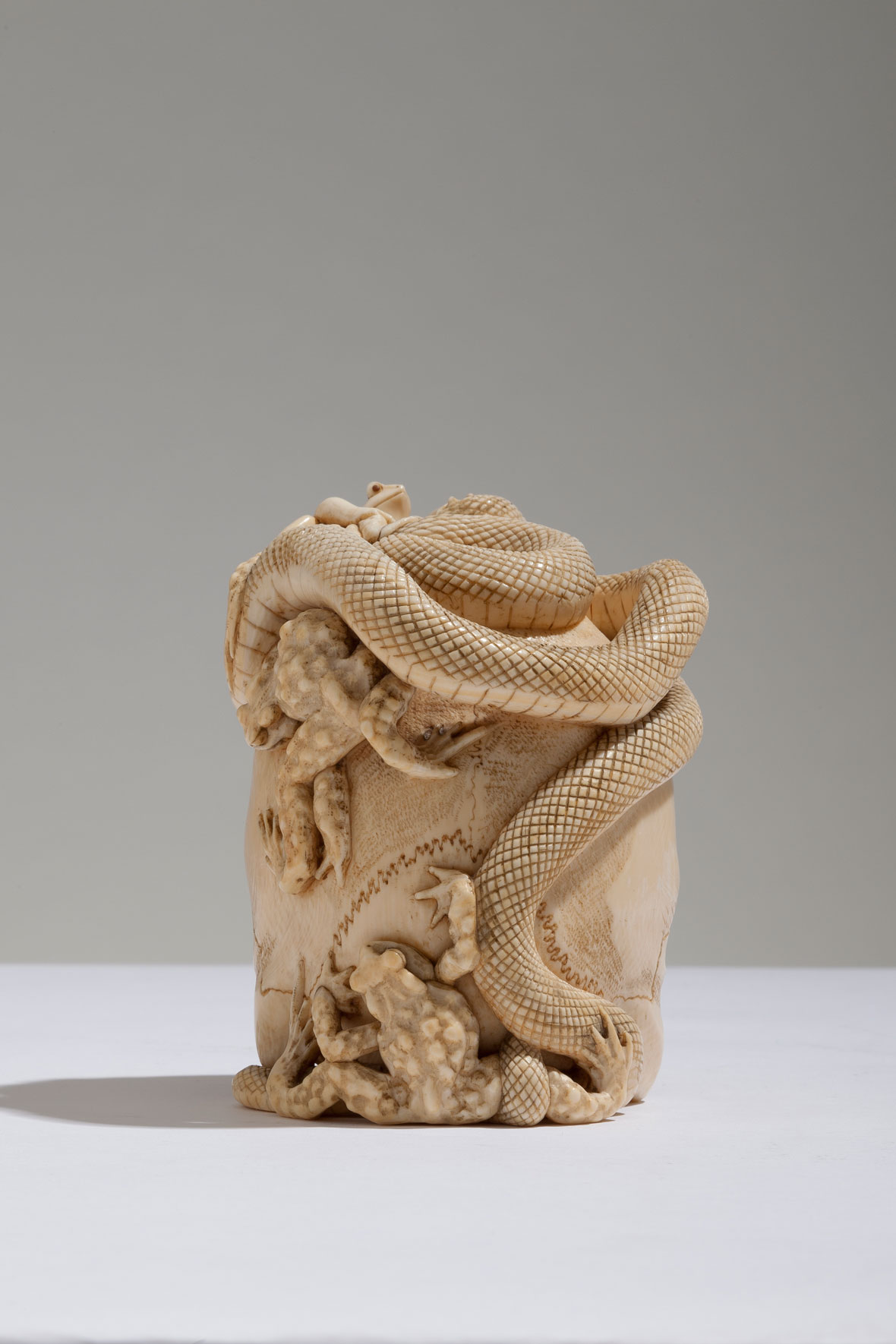 Japanese Ivory Skull with Coiled Snake and Toads